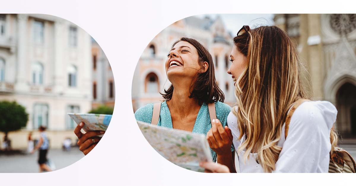 stock image two female tourists with map; travel 2023; tourism 2023; DCC; ATMs; currency conversion; direct currency conversion; foreign currency; currency exchange